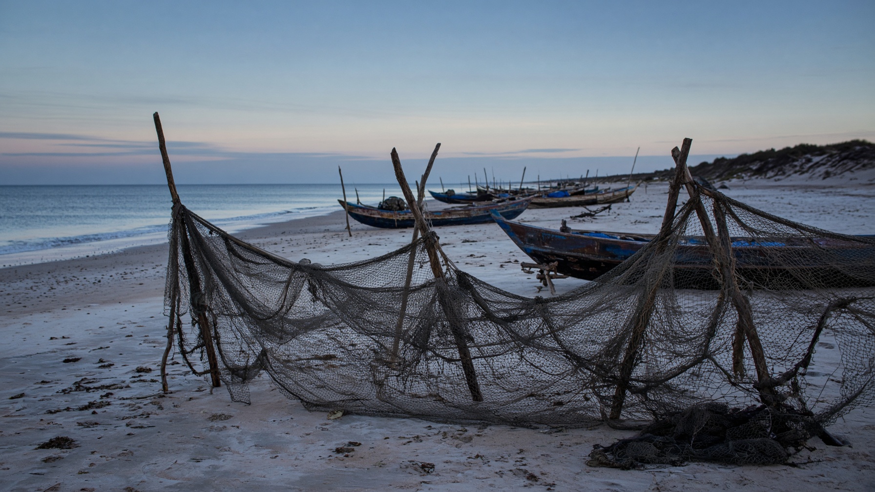 Fishing nets drying on a Somali beach at dawn.